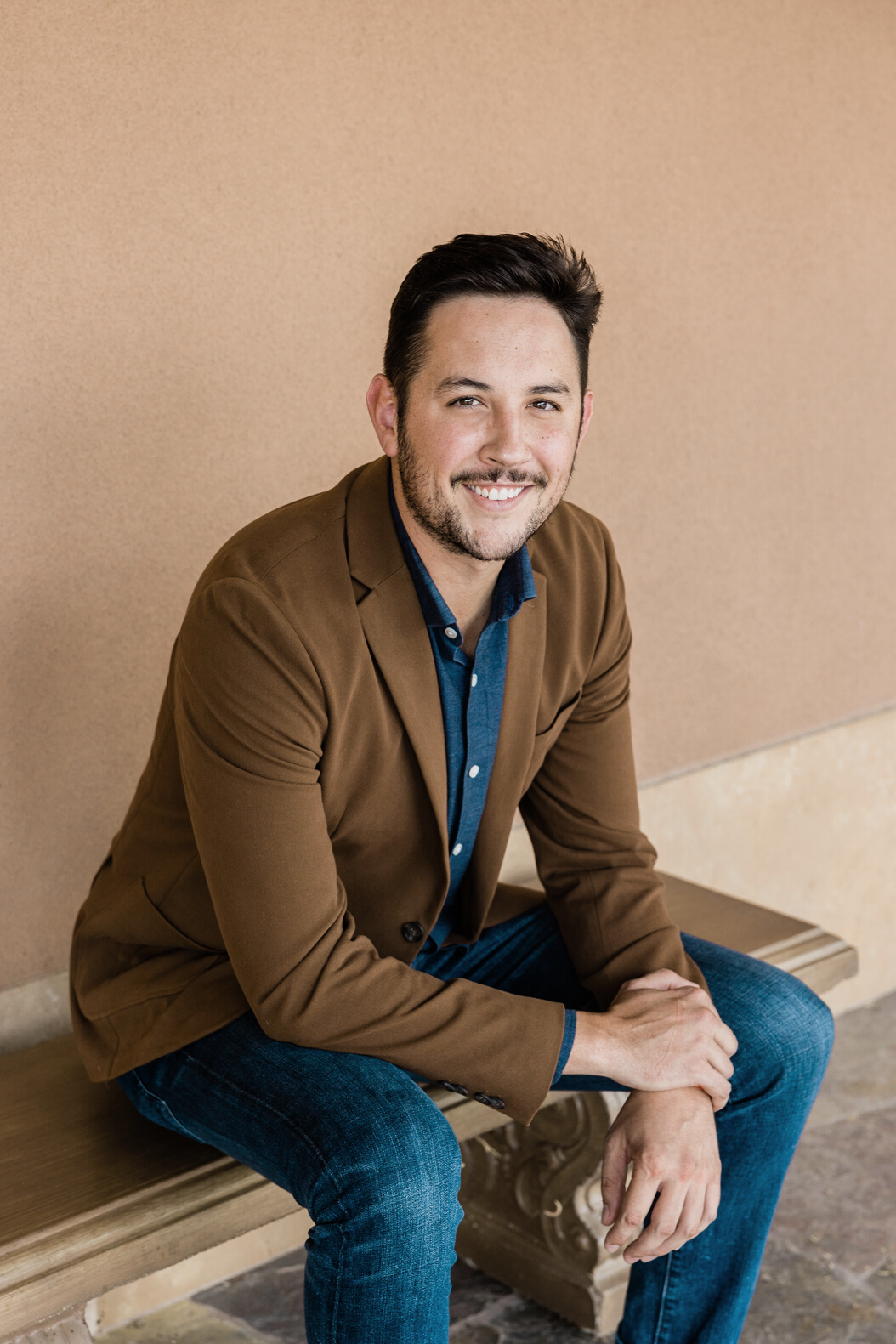 Man in Suede Business Jacket and Denim Pants